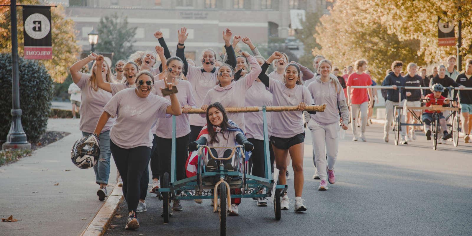 Students at the Bed Races during Homecoming Weekend